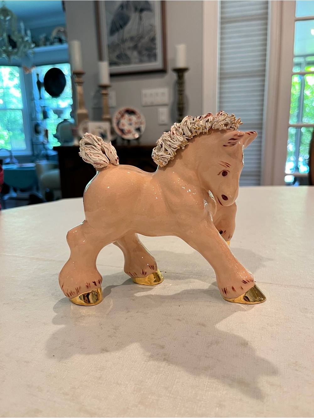 Vintage mid-century peach & gold ceramic spaghetti mane horse figurine. GUC!